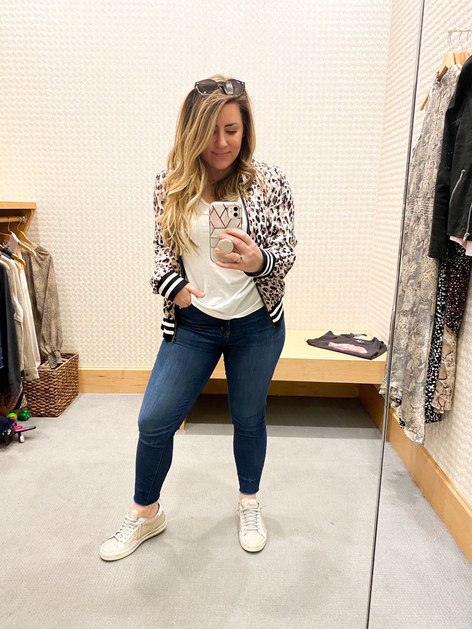 Evereve Outfits by popular Ohio fashion blog, Coffee Beans and Bobby Pins: image of a woman standing in a dressing room and wearing Evereve Agolde Sophie Crop, Evereve P448 Glitter Sneaker, Evereve Peyton Jensen Brooke Bomber Jacket, and Evereve Z Supply Short Sleeve V Neck Tee.