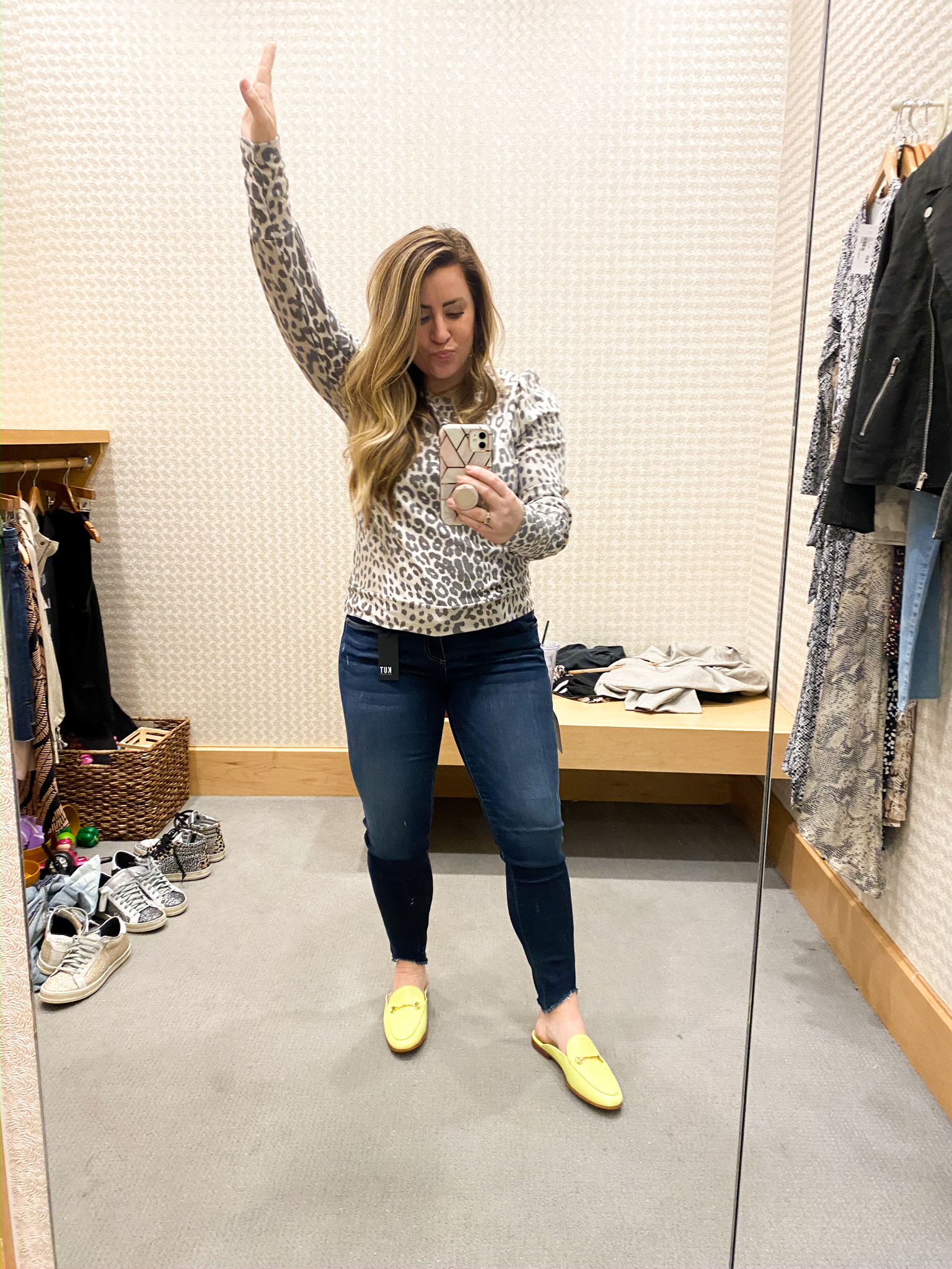 Evereve Outfits by popular Ohio fashion blog, Coffee Beans and Bobby Pins: image of a woman standing in a dressing room and wearing Evereve Chaser Leopard Puff Sleeve Sweatshirt, Evereve Agolde Sophie Crop, and Evereve Sam Edelman Linnie Slide.
