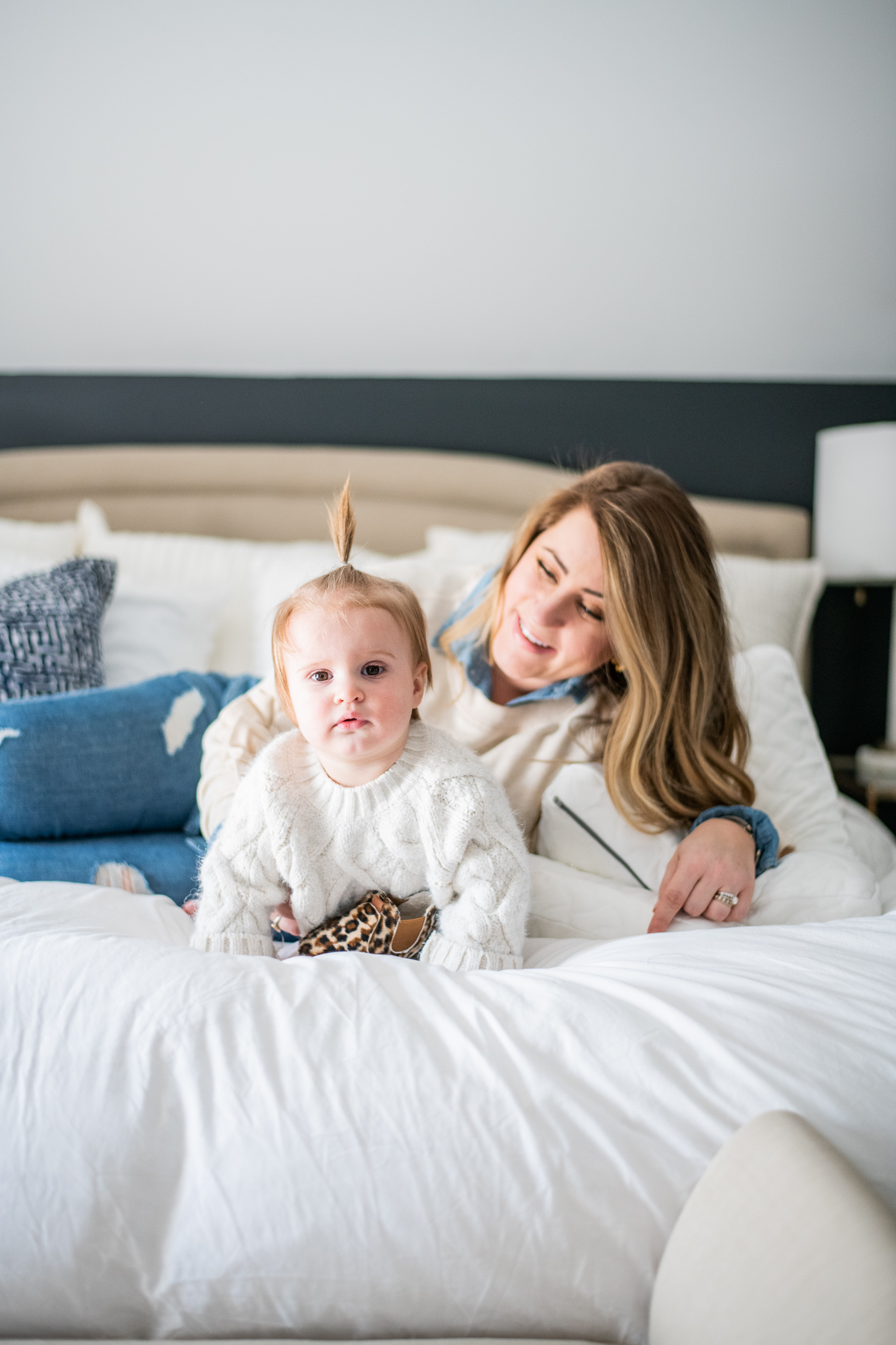Tempur Pedic Pillows featured by top US lifestyle blog Coffee Beans and Bobby Pins; Image of woman playing this her daughter.