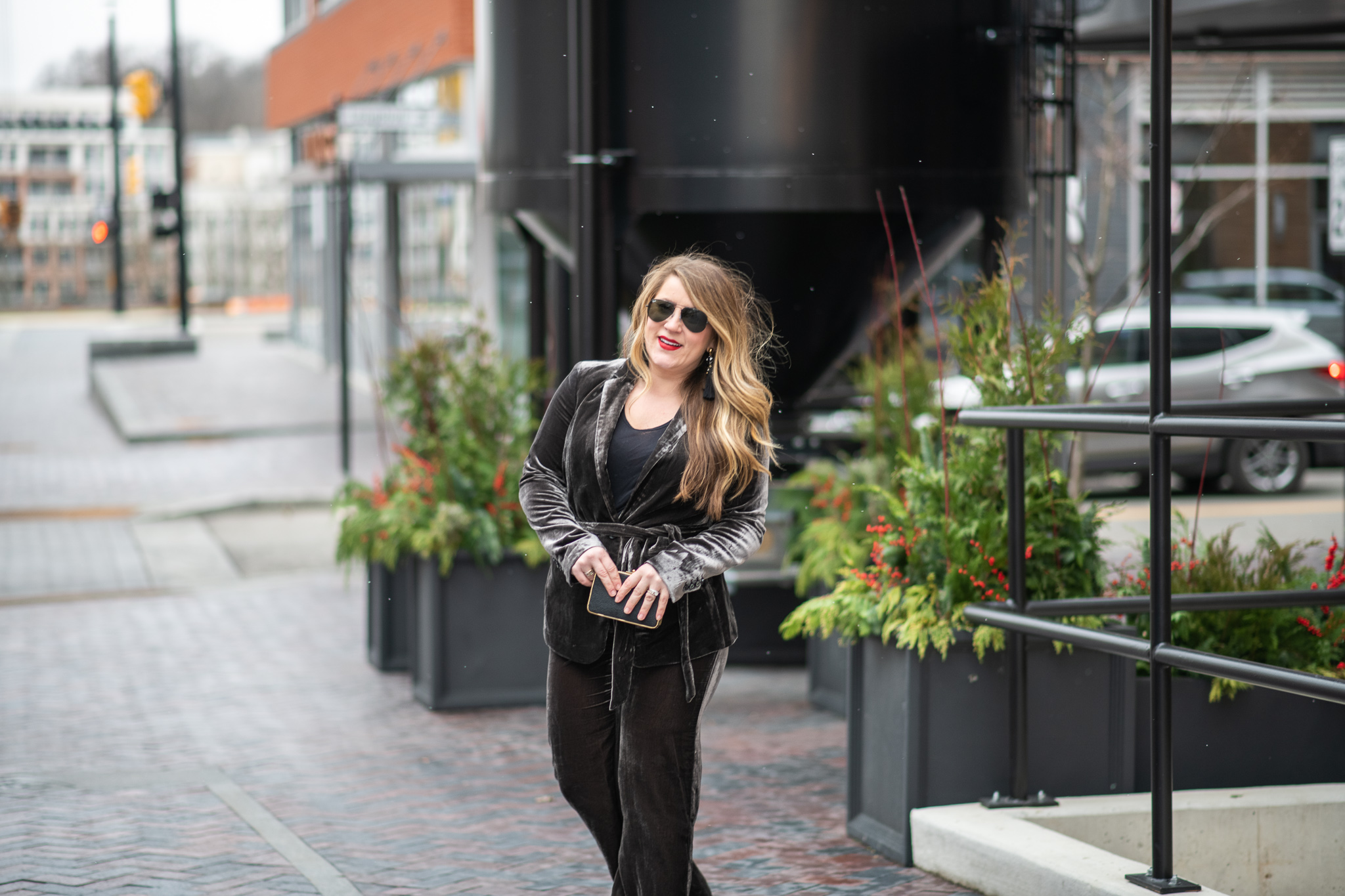 Velvet Pant Suit featured by top US fashion blog Coffee Beans and Bobby Pins; Image of a woman wearing Ann Taylor velvet jacket, Ann Taylor velvet pants, Nordstrom clutch, Nordstrom tank, BCBG shoes and Ray-Ban sunglasses