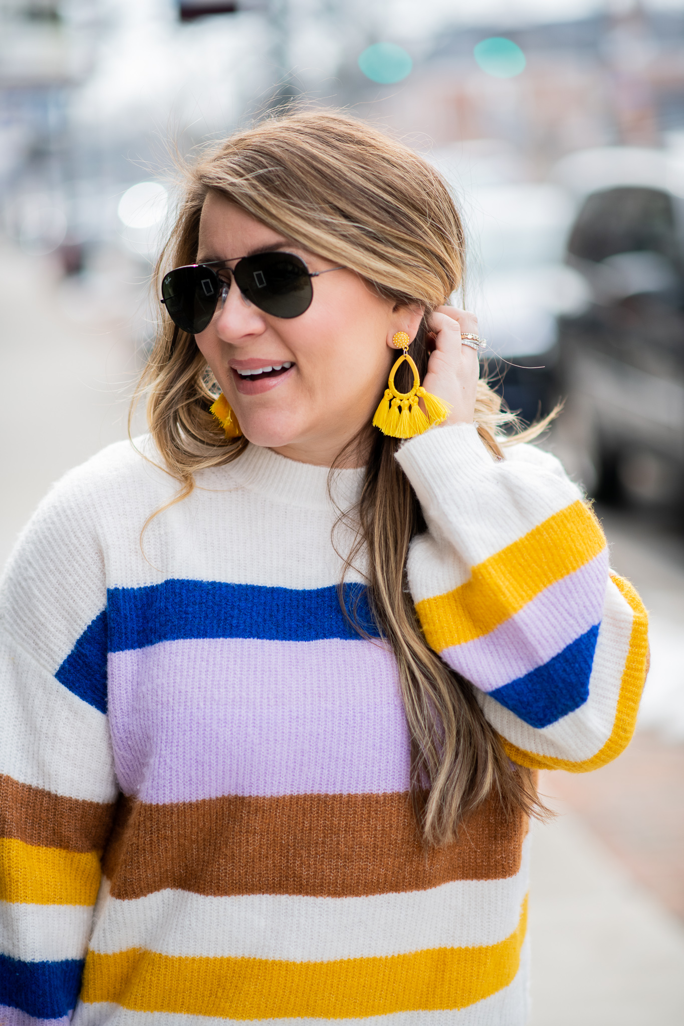Striped Sweater featured by top US fashion blog Coffee Beans and Bobby Pins; Image of a woman wearing Express striped sweater, J.Crew jeans, DSW mules, Amazon sunglasses, Sugarfix earrings and Louis Vuitton bag.