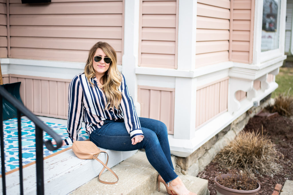 Striped Blush Blouse featured by top US fashion blog, Coffee Beans and Bobby Pins; image of woman wearing an express striped blouse, J.crew jeans, louis vuitton bag, target earrings and Nordstrom shoes