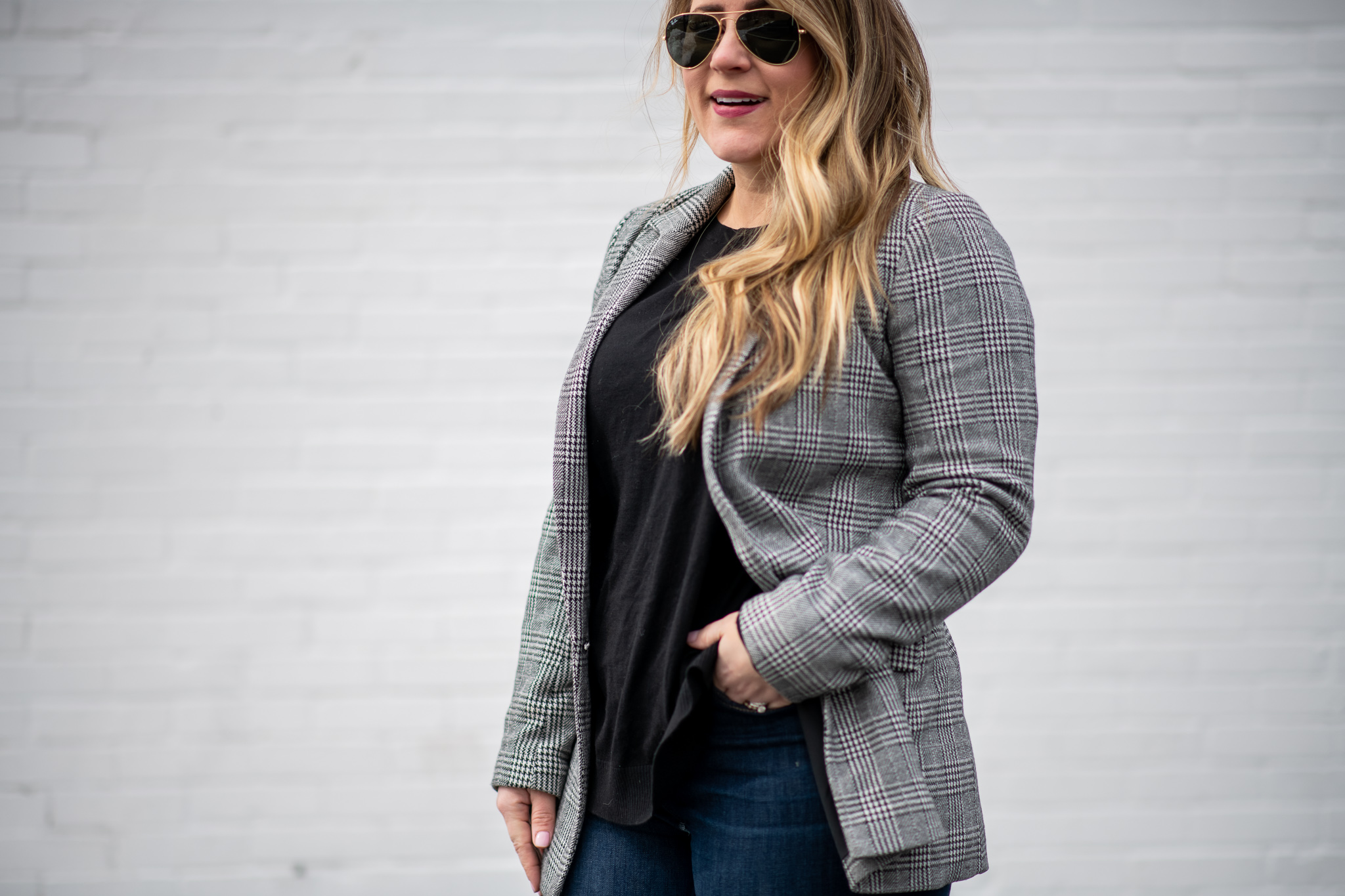 Black and White Plaid Blazer featured by top US fashion blog Coffee Beans and Bobby Pins; Image of a woman wearing J.Crew jeans, Christian Louboutin heels, Gap blazer and Express sweater.