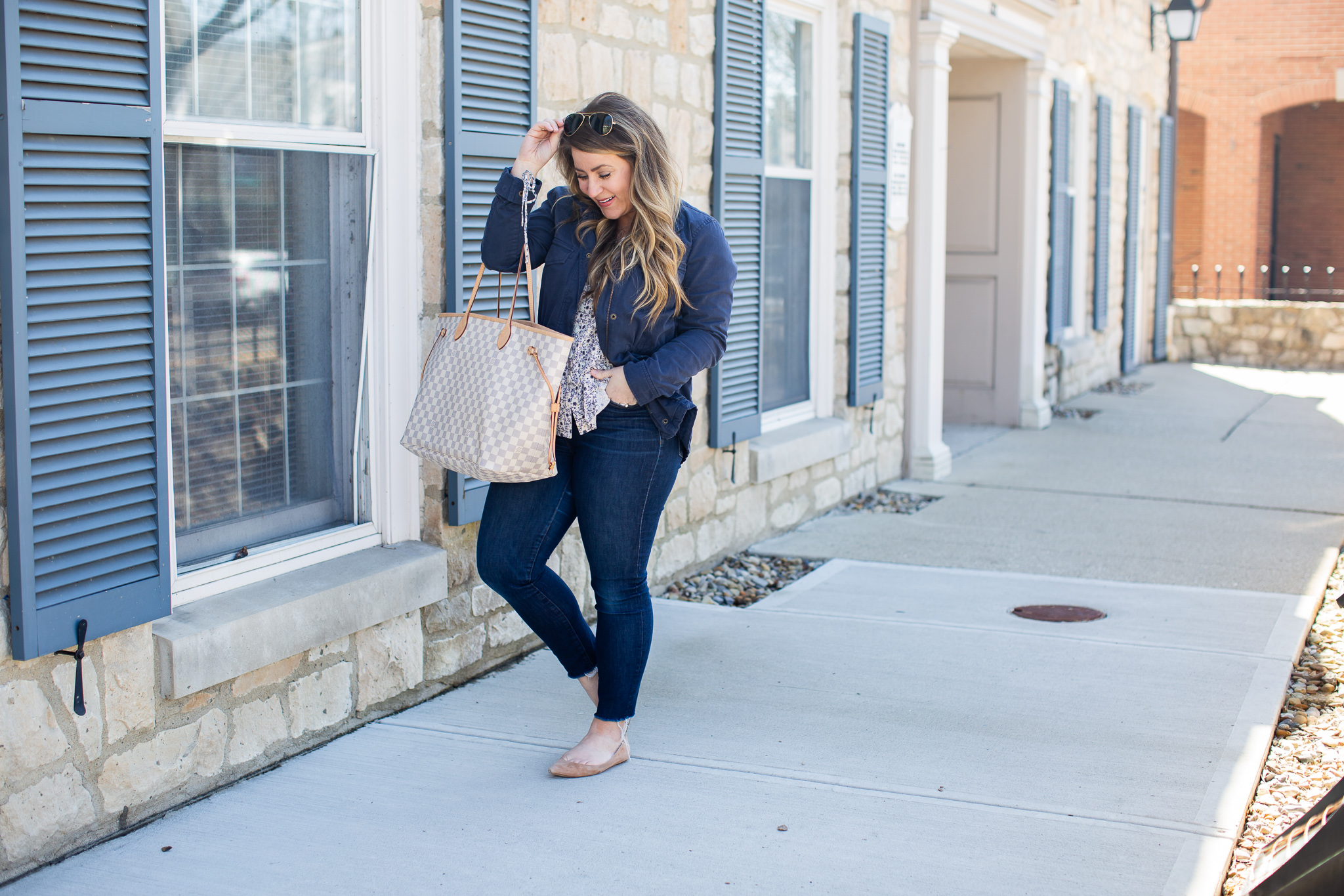 Raw Hem Jeans featured by top US curvy fashion blog Coffee Beans and Bobby Pins; Image of a woman wearing LOFT top and J.Crew jeans.