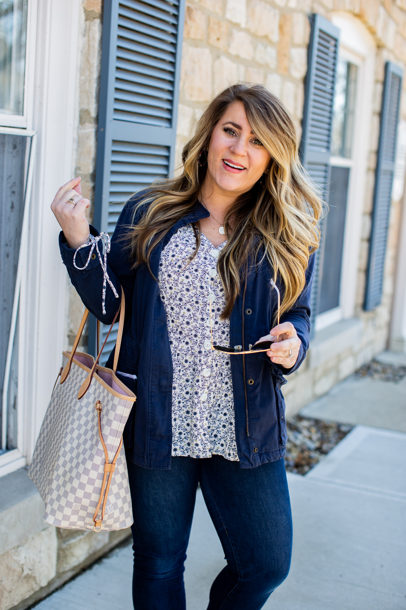 Raw Hem Jeans featured by top US curvy fashion blog Coffee Beans and Bobby Pins; Image of a woman wearing LOFT top and J.Crew jeans.