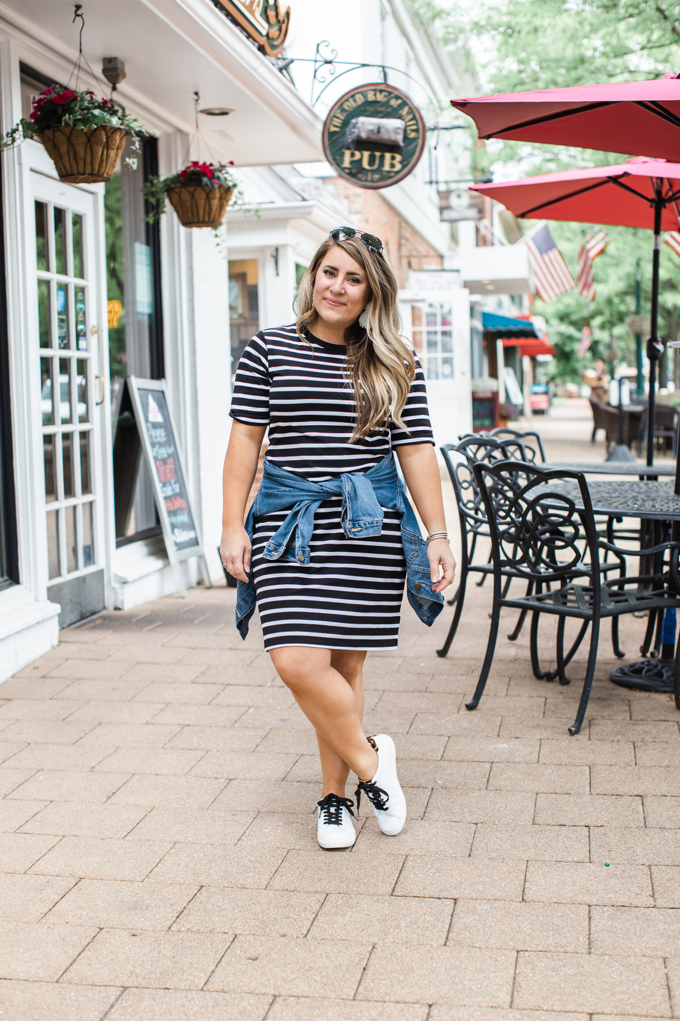 Striped T-Shirt Dress featured by top US fashion blog Coffee Beans and Bobby Pins; Image of a woman wearing Old Navy dress, J.Crew sneakers and Madewell denim jacket.