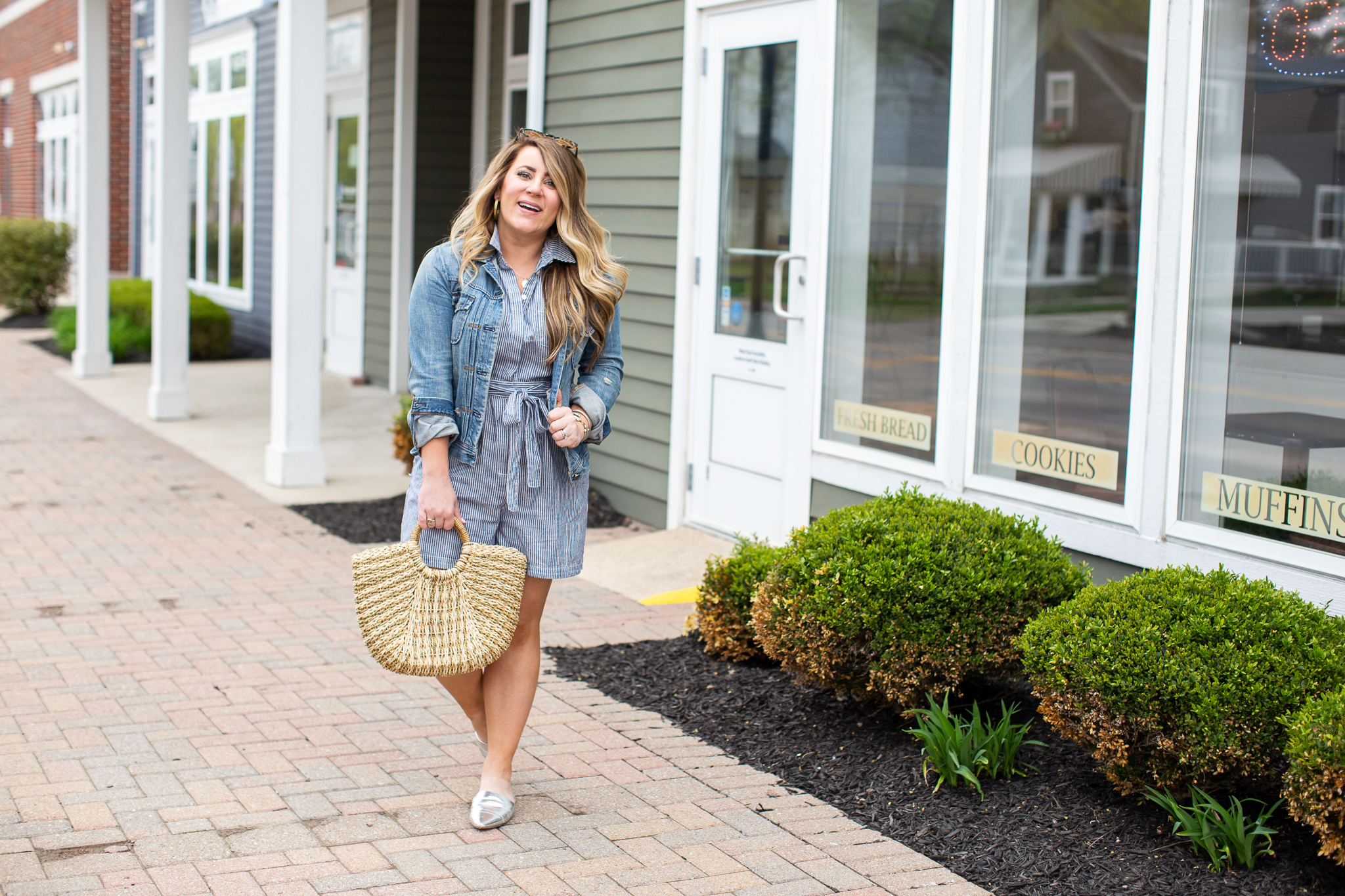 Collared Romper featured by top US fashion blog Coffee Beans and Bobby Pins; Image of a woman wearing Anthropologie romper, Target mules and Madewell denim jacket.
