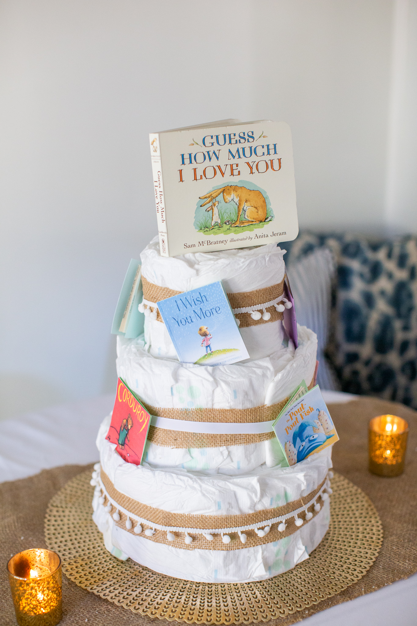  Story Book Baby Shower Ideas by popular North Carolina life and style blog, Coffee Beans and Bobby Pins: image of a diaper cake with children's picture books.