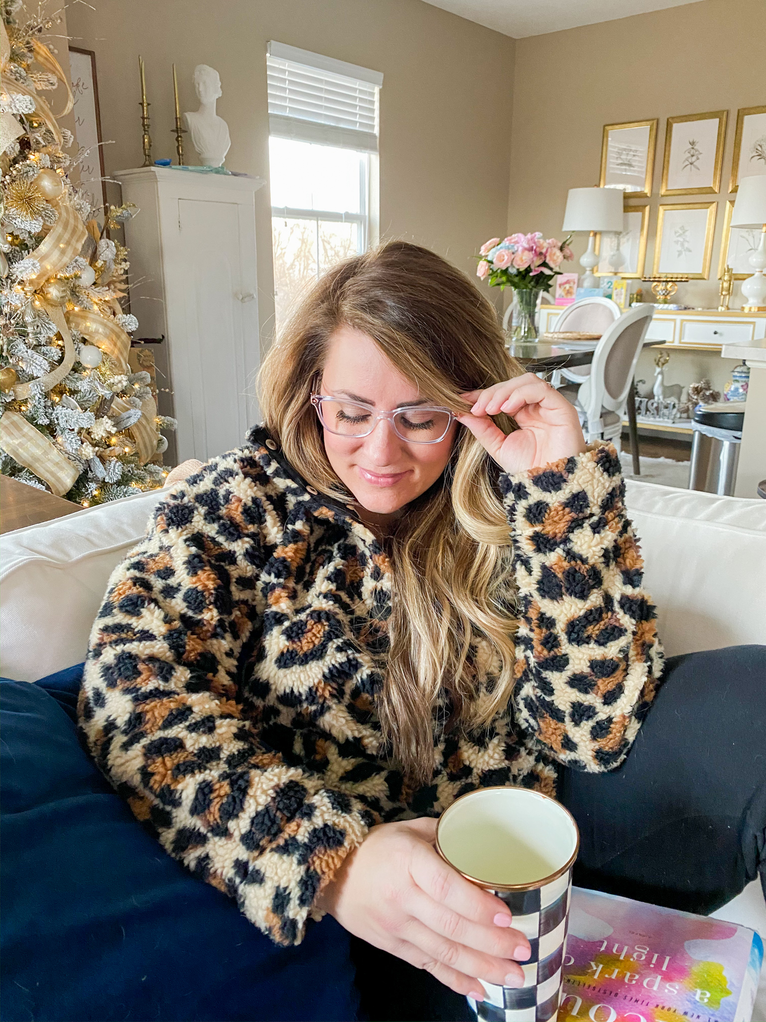 New Glasses with Lenscrafters at Macys by popular North Carolina life and style blog, Coffee Beans an Bobby Pins: image of a woman sitting on her couch and wearing glasses from Lenscrafters at Macys