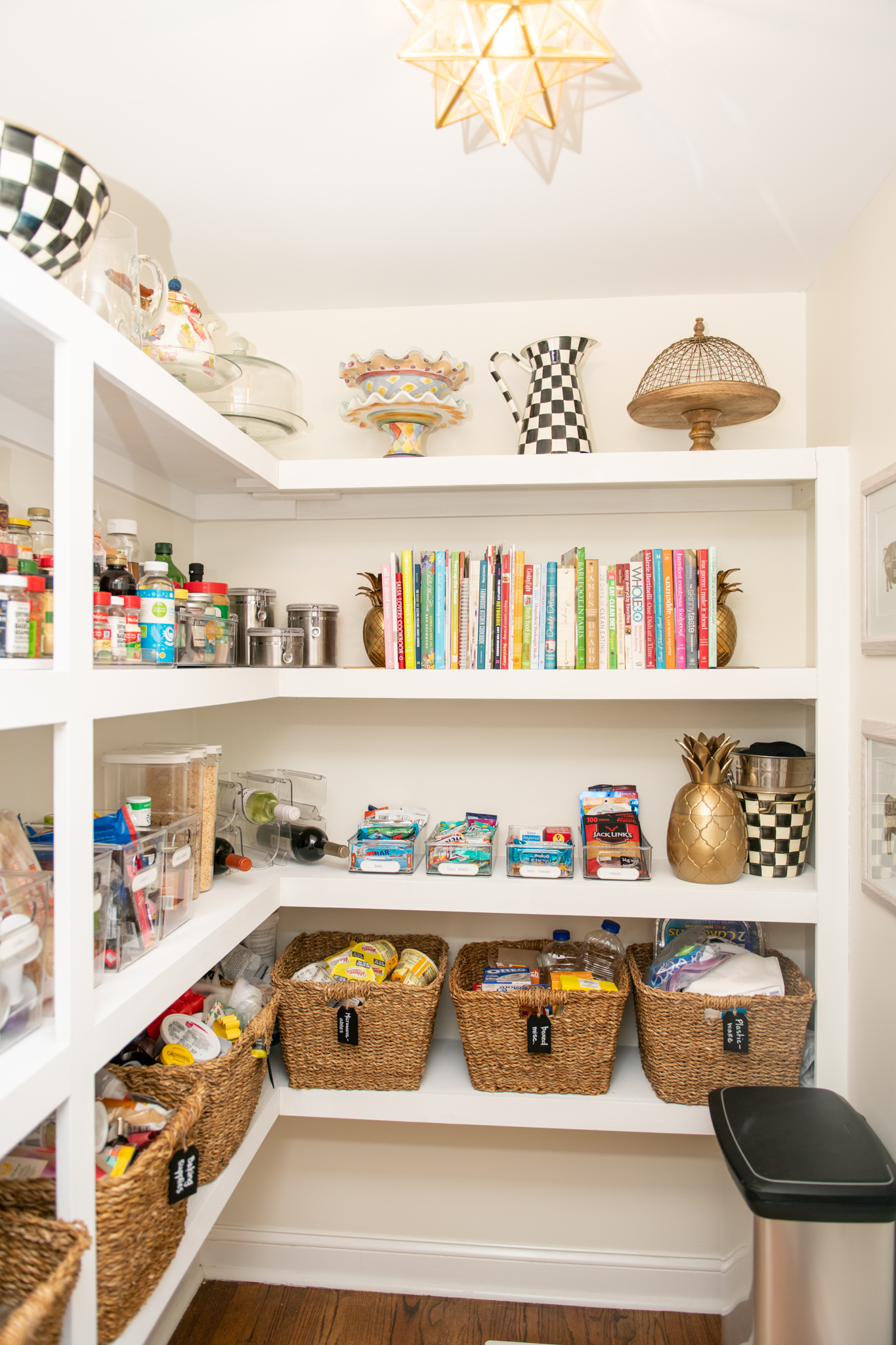 Pantry Organization Hacks by popular Ohio lifestyle blog, Coffee Beans and Bobby Pins: image of an organized pantry with a Amazon JONATHAN Y JYL9035B Stella 9.75" Moravian Star Metal/Glass Flush Mount, Amazon mDesign Plastic Kitchen Pantry Cabinet, The Container Store Tapered Hogla Storage Bin with Handles, Amazon nuLOOM Rigo Hand Woven Jute Area Rug, and Amazon Copco 2555-0188 Non-Skid 3-Tier Spice Pantry Kitchen Cabinet Organizer.