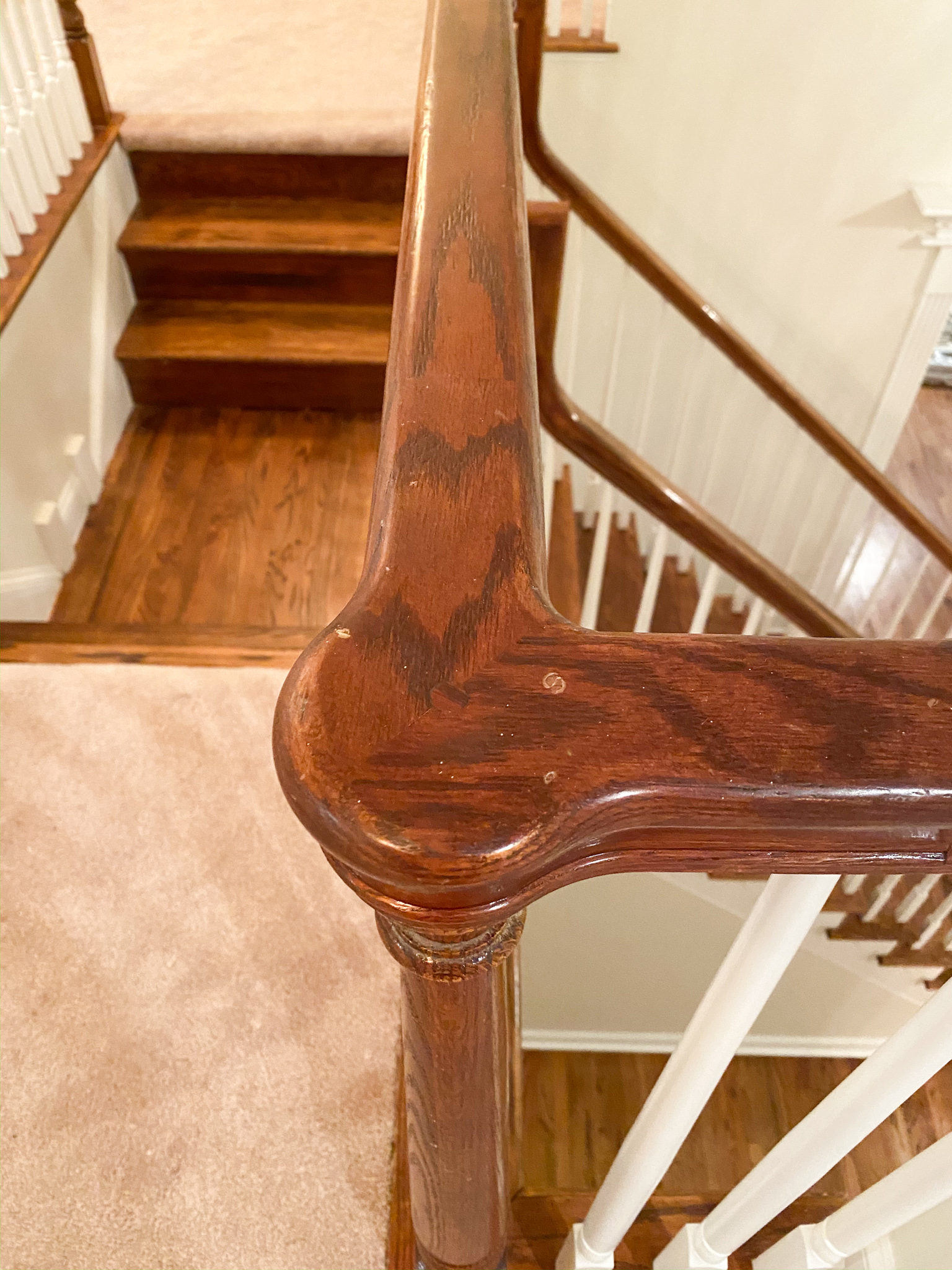 DIY Stair Railing Makeover by popular Ohio DIY blog, Coffee Beans and Bobby Pins: before image of a dated staircase. 