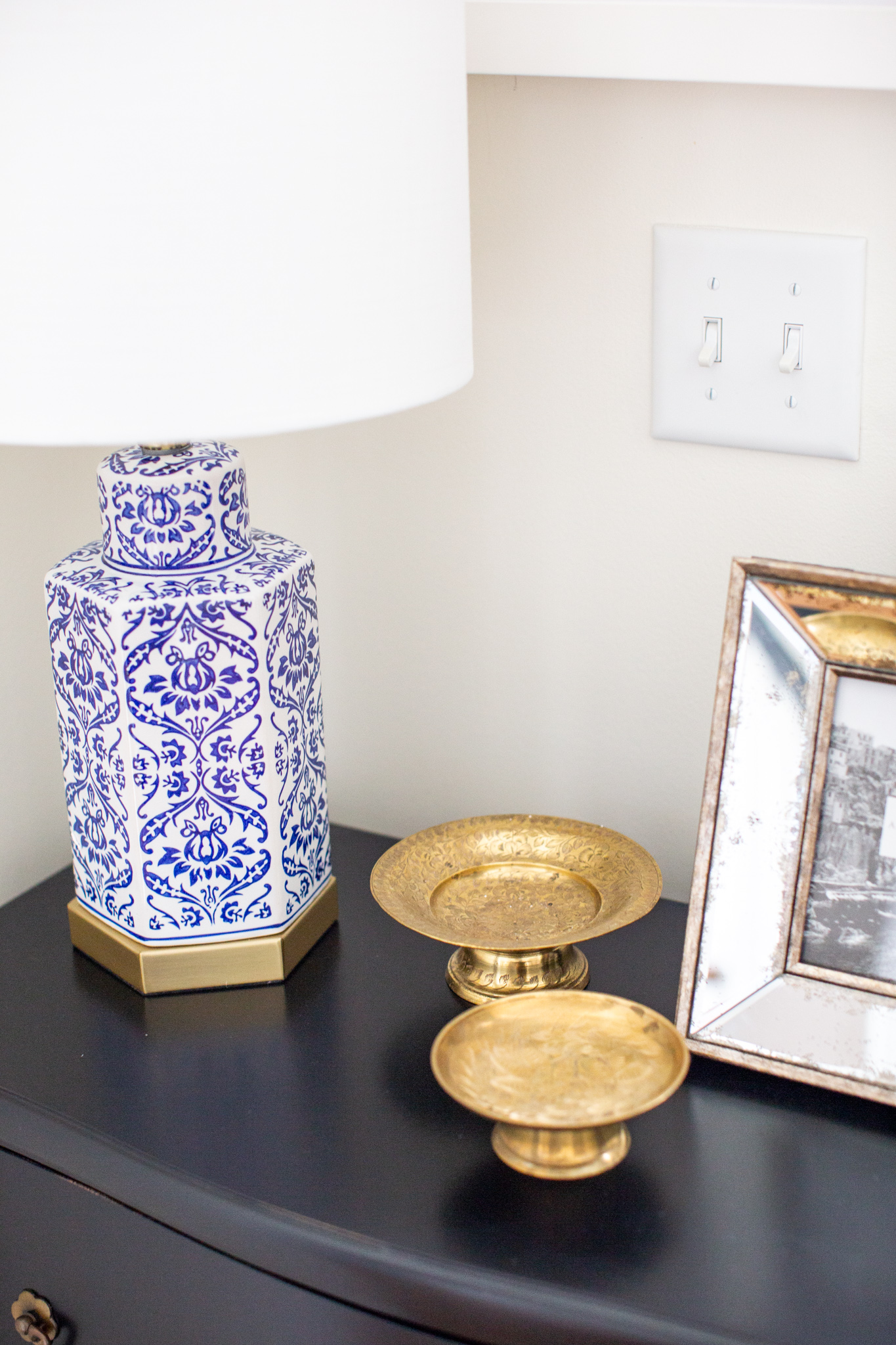 Mixing Old and New Furniture by popular Ohio life and style blog, Coffee Beans and Bobby Pins: image of a antique pedestals and blue and white lamp from Target. 