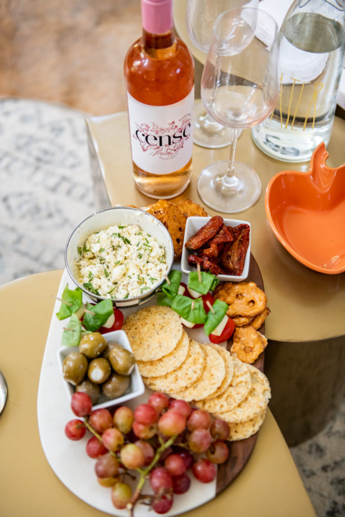 Snack Board by popular Ohio food blog, Coffee Beans and Bobby Pins: image of a snack board next to a bottle of Cense wine.  