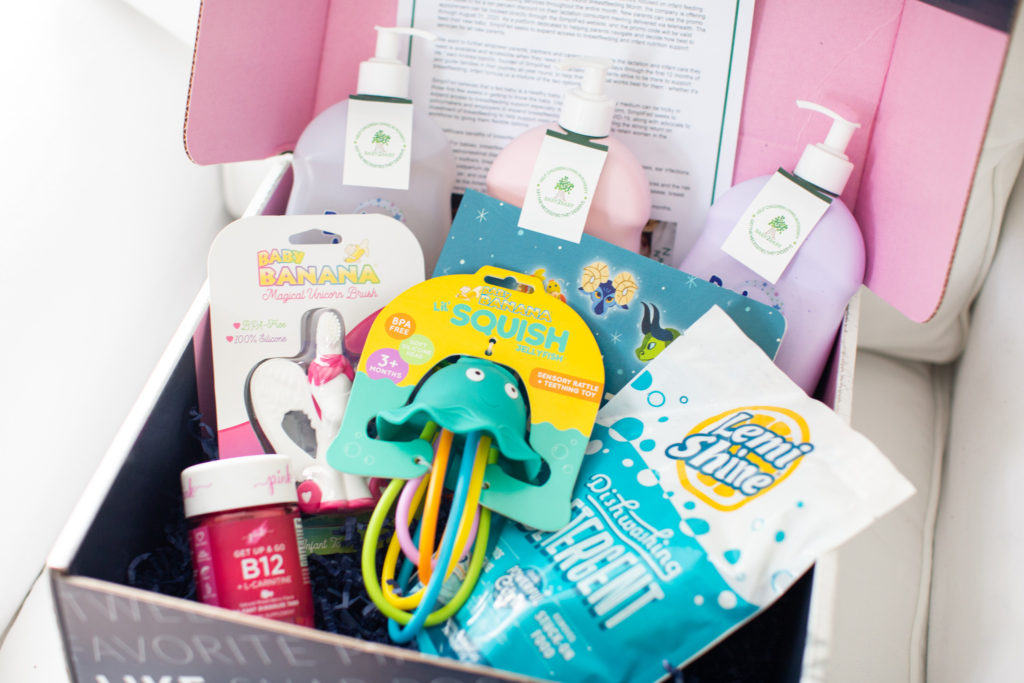 Baby Products by popular Ohio motherhood blog, Coffee Beans and Bobby Pins: image of a box filled with a Baby Banana magic unicorn brush, Baby Banana Squish jelly fish, Lemi Shine detergent, and Baby Magic bath products, 