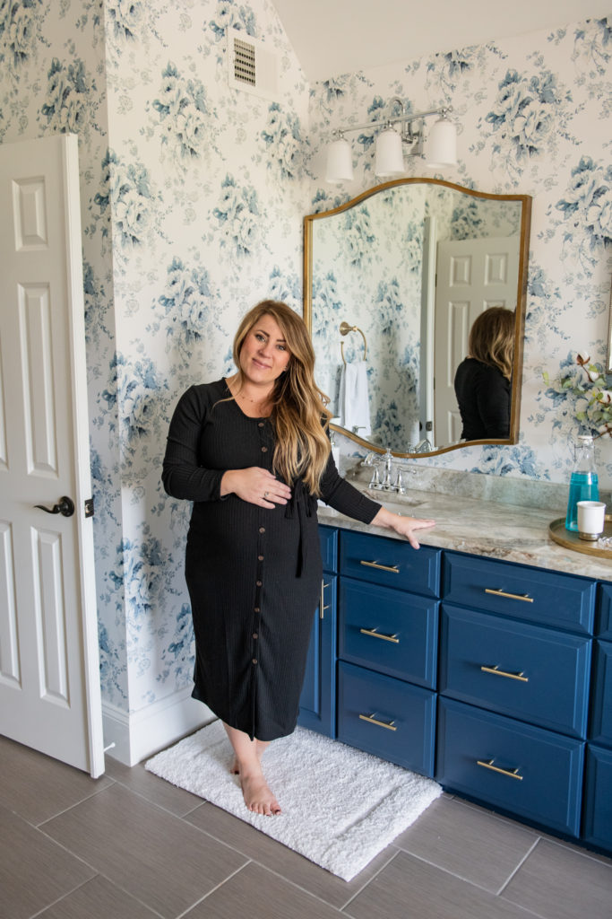 Master Bedroom Remodel by popular Ohio life and style blog, Coffee Beans and Bobby Pins: image of master bathroom with blue and white floral wallpaper, blue vanity and gold frame mirrors. 