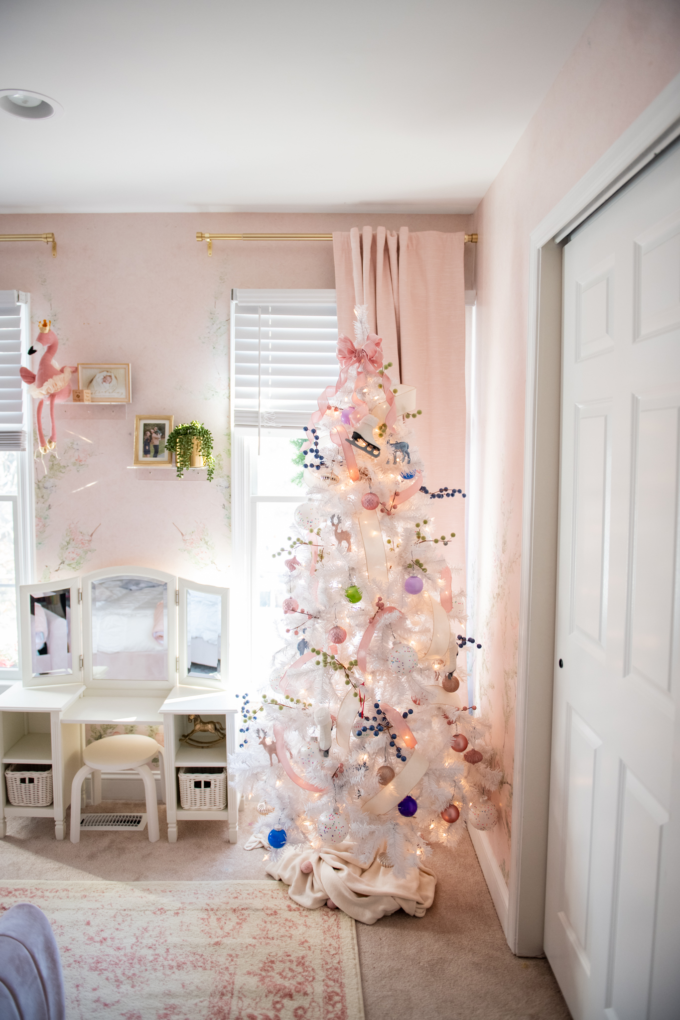 Holiday Decor by popular Ohio life and style blog, Coffee Beans and Bobby Pins: image of a little girls room decorated with a faux white Christmas tree. 