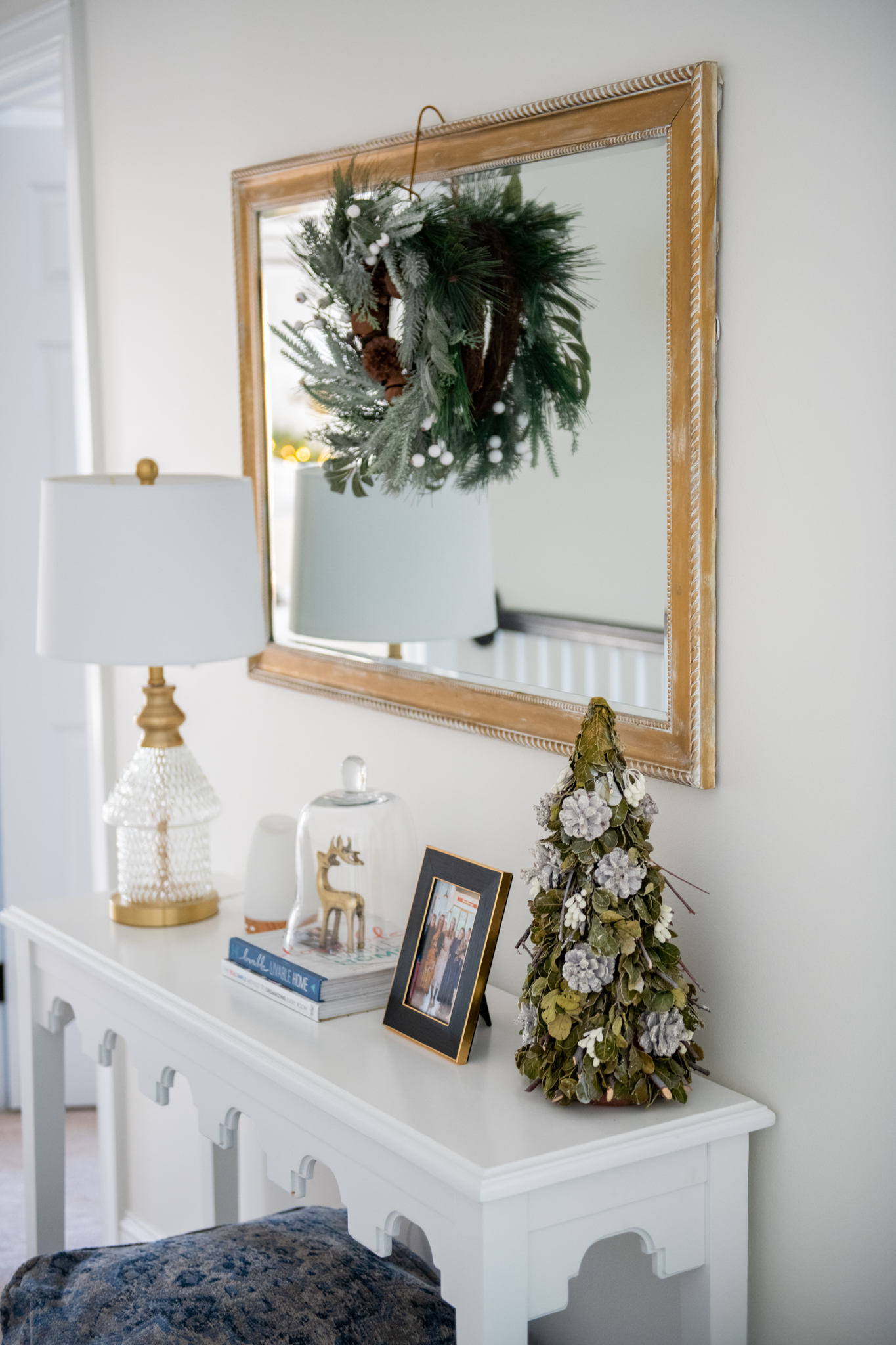 Holiday Decor by popular Ohio life and style blog, Coffee Beans and Bobby Pins: image of a bedroom decorated with a faux wreath and Christmas tree decor. 