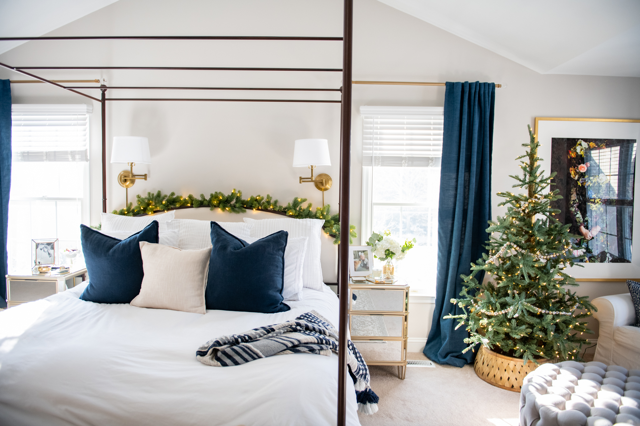 Holiday Decor by popular Ohio life and style blog, Coffee Beans and Bobby Pins: image of a bedroom decorated with faux garland and a faux Christmas tree. 