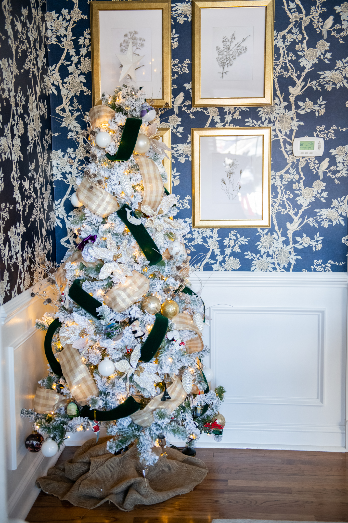 Christmas Home Tour by popular Ohio life and style blog, Coffee Beans and Bobby Pins: image of a flocked Christmas tree decorated with ribbon and ornaments. 