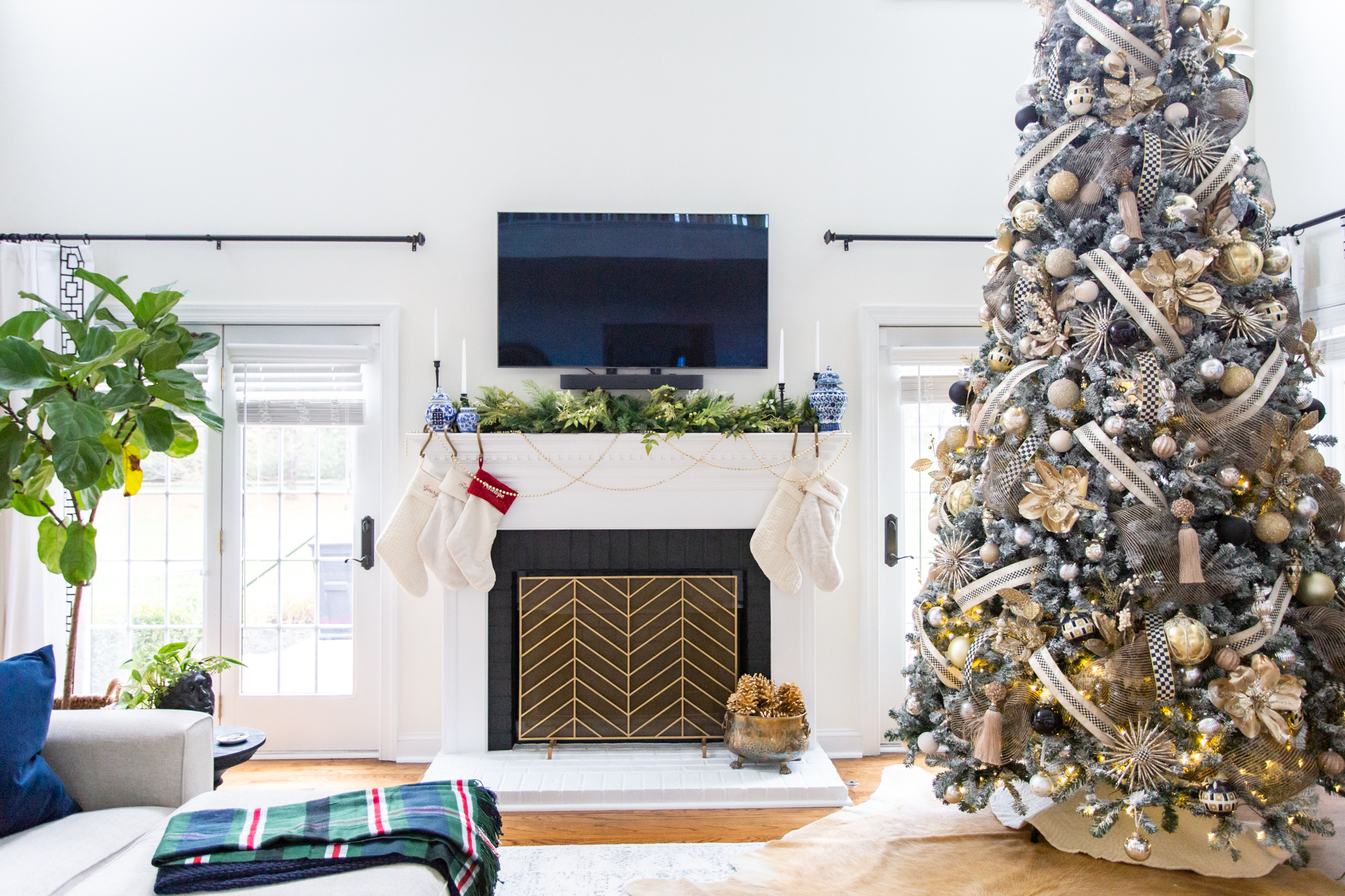 Christmas Tree Decorating Tips by popular Ohio life and style blog, Coffee Beans and Bobby Pins: image of a 12 foot flocked Christmas tree decorated with Mackenzie-Childs ornaments. 