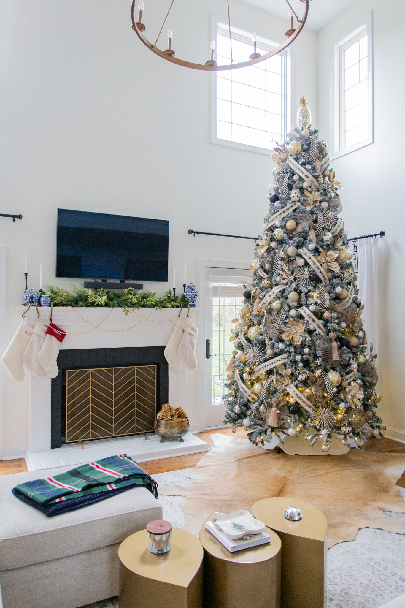 Christmas Tree Decorating Tips by popular Ohio life and style blog, Coffee Beans and Bobby Pins: image of a 12 foot flocked Christmas tree decorated with Mackenzie-Childs ornaments. 